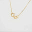Elegant 18k gold heart necklace chain with clasp detail.