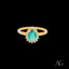 Gold ring featuring a pear-shaped emerald and diamonds in 18k gold design
