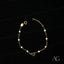 Elegant 18k gold heart bracelet with small pearls and a charming heart charm