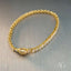 Elegant zirconia tennis bracelet in 18k gold with dazzling stones from Art Gold Jewelry.