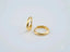 Two gold wedding bands in 18k yellow gold, symbolizing timeless elegance and love