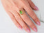 Gold ring featuring baguette-cut green tourmaline in 18k gold slide-on design