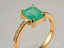 Emerald Majesty 18K Gold Emerald Ring featuring a carat radiant-cut emerald and diamond accents