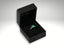 Emerald Majesty ring featuring a carat radiant-cut emerald in a luxurious black box