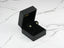 Square Emerald Stud Earrings in a Black Jewelry Box showcasing Green Cubic Zirconia Halo Design