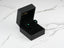 Emerald Radiance earrings in a black jewelry box with 18k gold green CZ studs