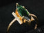 Gold ring featuring a green tourmaline and diamond accents from Emerald Whisper collection