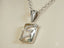 Silver pendant with crystal and diamond accents on an 18k white gold chain necklace