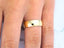 Eternal Love 18k Wedding Band on finger, showcasing elegant simplicity and luxurious 18k solid gold craftsmanship.