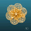 Intricate 18k gold flower ring with filigree brooch design and floral patterns