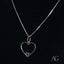 Heart-shaped silver pendant necklace with 14k gold accent, a true heartfelt glint pendant