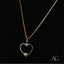 Heartfelt glint pendant featuring a heart-shaped 14k gold necklace with a gold bead
