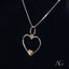 Silver heart-shaped necklace with 14k gold accent, a perfect heartfelt glint pendant