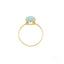 Gold ring featuring a round blue topaz gemstone in a stunning setting