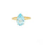 Gold ring featuring a pear-shaped blue topaz gemstone in carat gold setting