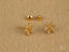 Floral Spark 18K Gold CZ Flower Stud Earrings featuring gold snowflake design with clear gemstones