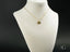 Gold heart pendant necklace on white bust showcasing Forever Hearts Best Friends design