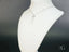 Delicate 18k white gold necklace featuring Frost Glow Crystal Pendant on a white bust