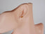 Ear displaying Geometric Diamond Earrings in Certified 18k Solid Gold art jewelry