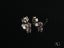 Pair of silver stud earrings with pink stones in Gleam & Grace white gold tourmaline style