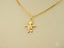 Gold pendant necklace with golden mini charm boy figure in 18k gold