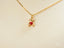 Golden Cub Bear Pendant in 18k gold with a red heart on a delicate chain necklace