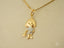 Gold pendant charm of a cartoon puppy in crystal shirt from Golden Doll 18k Gold collection