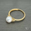 Golden Elegance 7mm pearl ring in 18k gold band, luxury jewelry.
