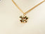 Gold butterfly pendant on a delicate chain necklace symbolizes personal growth in 18k gold