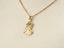 Gold pendant necklace with classical profile design, perfect for personal milestones