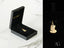 Gold pendant shaped like a classical bust, perfect for commemorating personal milestones