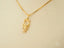 18k Gold Golden Grace Doll Girl Pendant Necklace with a charming stick figure design