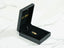 Black jewelry box with Golden Grace 18k Gold Doll Girl Pendant inside