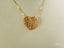 18k gold golden heart pendant necklace with textured lattice pattern