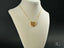 Gold heart pendant necklace with filigree detailing in 18k gold