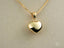 Gold heart pendant in 18k gold on a delicate chain necklace for a timeless look