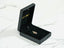 Black jewelry box with gold lettering showcasing an 18k Gold Golden Love Pendant ring