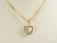 18k Gold heart-shaped pendant with cubic zirconia on a delicate chain necklace