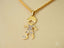 18k Gold pendant necklace featuring a boy with a soccer ball in Golden Moments design