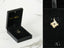 Gold puzzle piece pendant in a black box for Autism Awareness in 18k gold