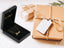 Golden Signature Necklace in jewelry box with gift packaging.