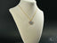 Gold chain necklace featuring a crystal-encrusted heart pendant from Golden Spark