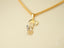 18k Gold Golden Treasure Pendant with a cartoon character charm on a chain