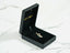 Black jewelry box showcasing a Golden Treasure Pendant crafted in 18k gold