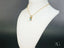 Gold chain necklace with a turquoise pendant, inspired by Ocean Breeze and set in 18k gold