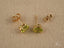 Peridot Radiance earrings featuring 18k gold pear-shaped studs with vibrant peridot gems