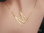 Gold letter M necklace featuring personalized initial letter pendant on box chain