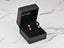 Gold flower earrings in a black jewelry box, showcasing Petal Drops 18K Gold Flower design