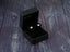 Gold stud earrings in a black jewelry box, art gold jewelry in 18K solid gold