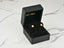 Gold CZ flower earrings in a black jewelry box, Radiant Blossom, solid 18K gold design